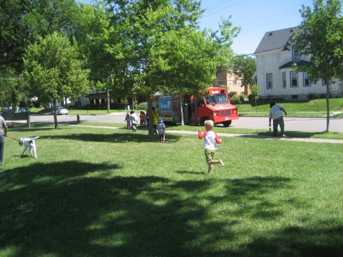 Kids running to line up for the food truck.